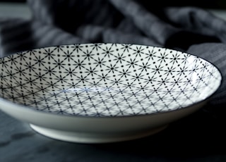 white and black ceramic plate