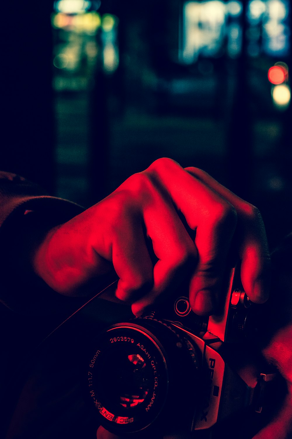 man holds SLR camera