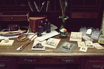 Close-up of legal papers and property deeds on a wooden desk