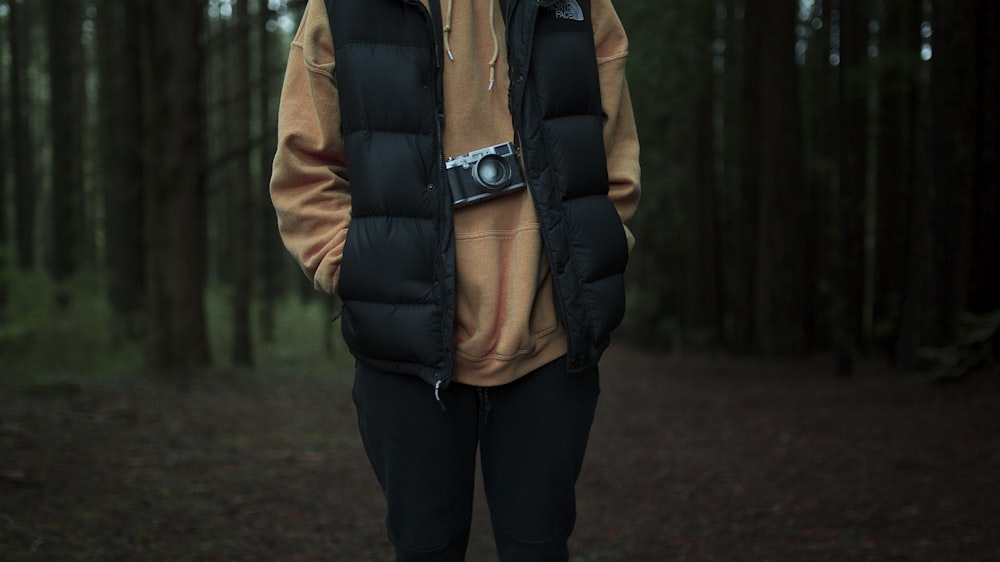 man stand surrounded by trees