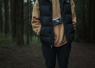 man stand surrounded by trees