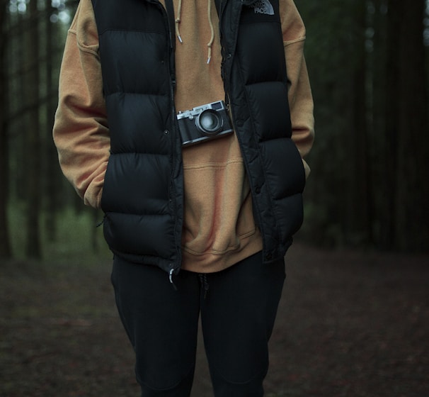 man stand surrounded by trees