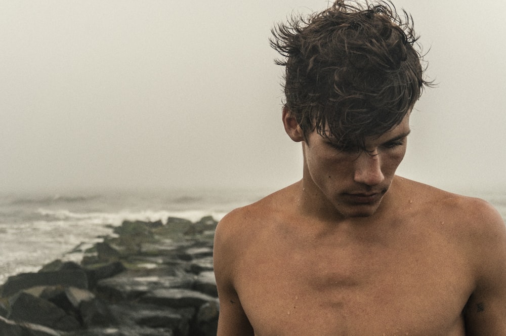 man behind sea during daytime