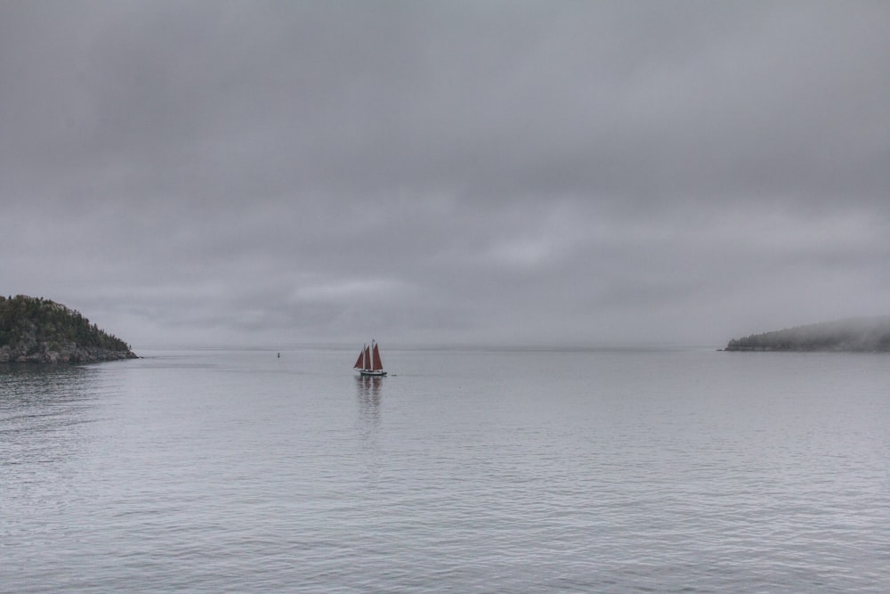 sailing boat on body of water