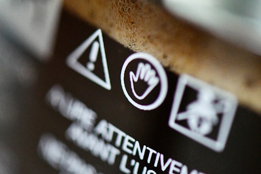 An illustration of a social media notification icon with a warning symbol and a helpful guidebook beside it.