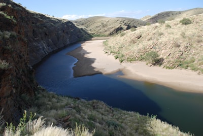 A serene view of a winding river through desert canyons.