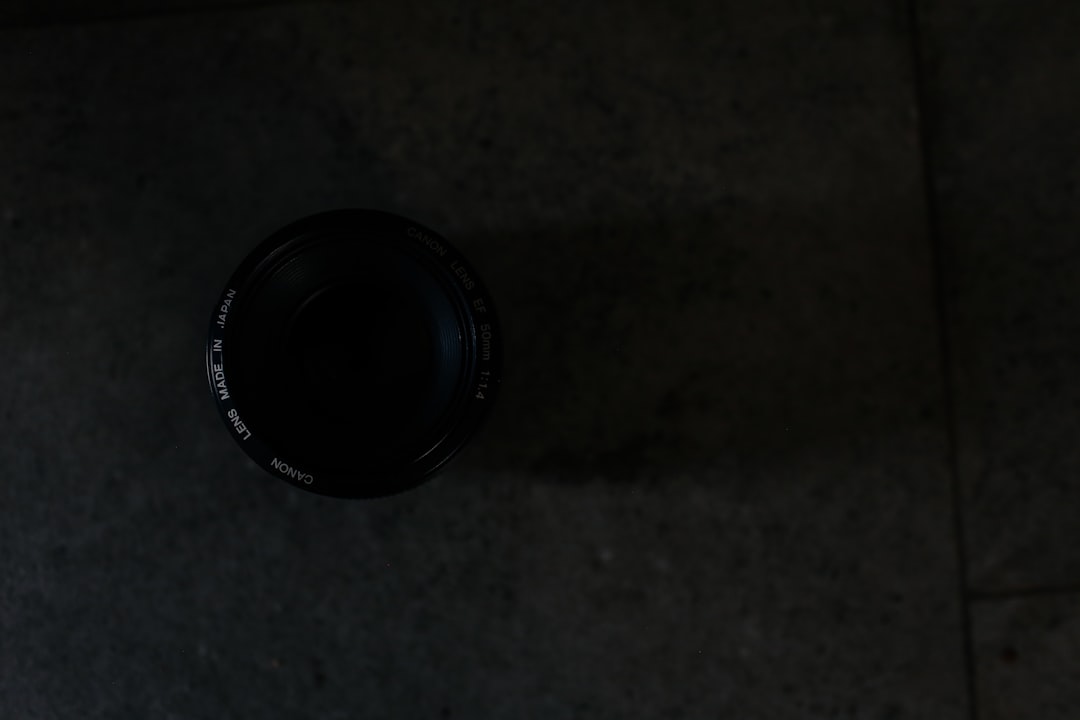 closeup photography of camera lens on floor tile