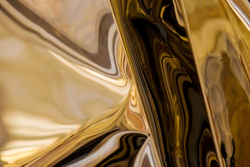 Close-up of textured old metallic gold surface meeting sleek digital patterns.