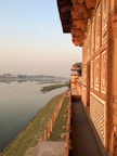 Balcony view from the Heritage Suite showing the vibrant life along the Ganges riverbank.