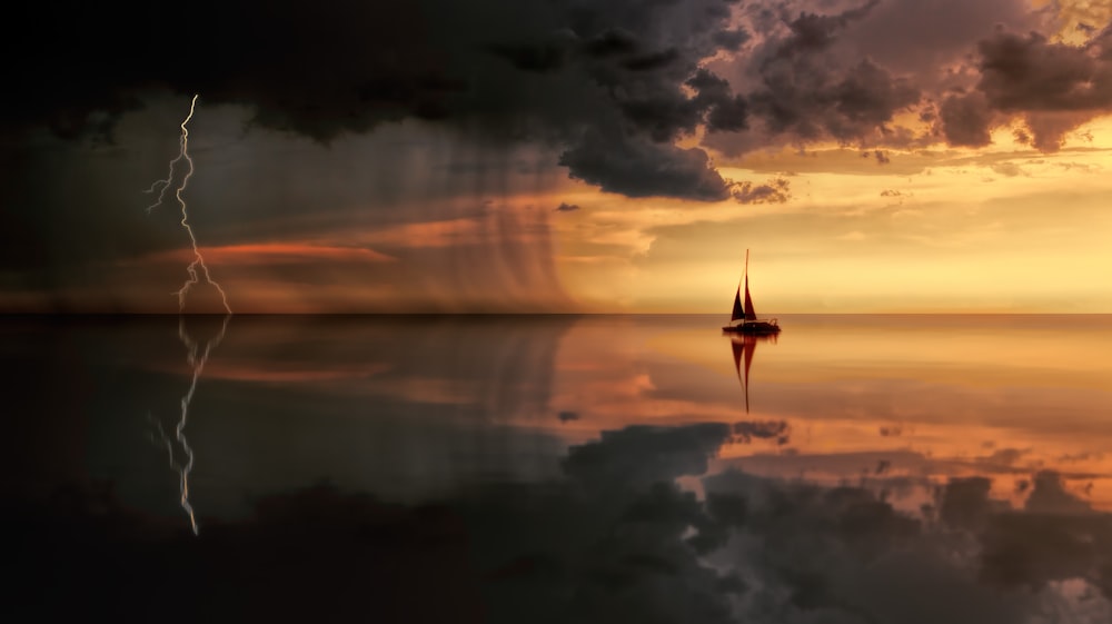 A sailboat in the ocean during a lightning storm.