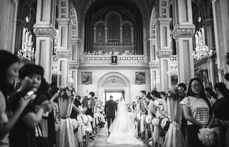 A serene wedding ceremony set in a beautifully decorated church.