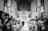 Elegant wedding ceremony with a couple exchanging vows in a beautifully decorated setting with golden accents.