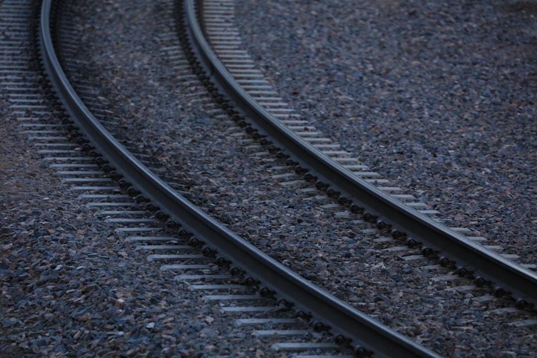 black metal train rail tracks