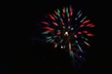 Close-up of the iconic Ayyan 120 shots classic night fireworks mid-explosion with vivid colors.