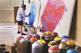 man spraying on white canvas