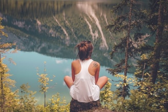 women's white tank top on top of the hill