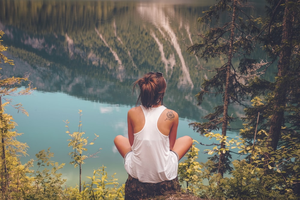 women's white tank top on top of the hill