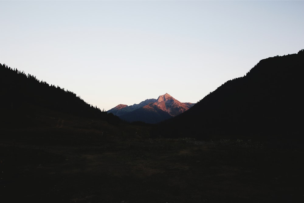 silhouette of valley and mountain