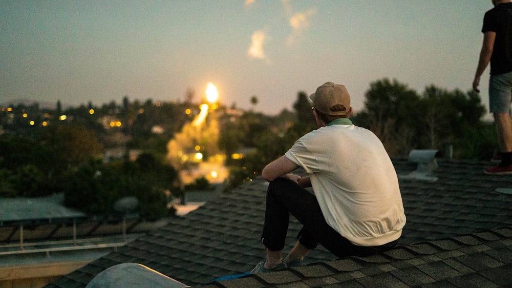 man sitting on shingles