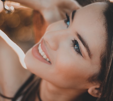 smiling woman with black hair and red lipstick