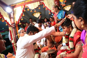 A vibrant outdoor wedding ceremony with guests celebrating.