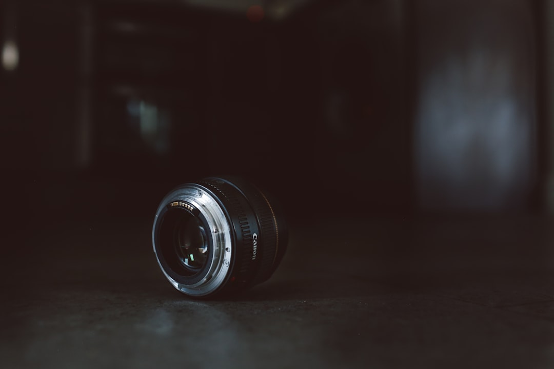 black camera lens on gray surface
