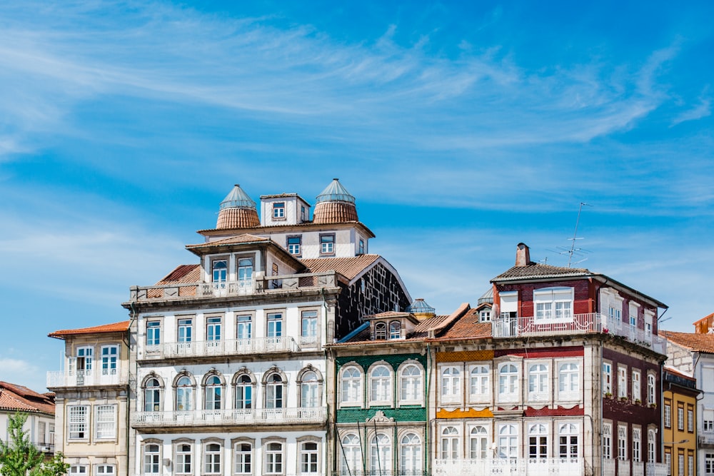 a group of buildings with a blue sky in the background