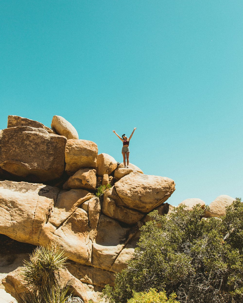 a person standing on top of a rock formation