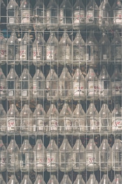 Rows of branded glass bottles ready for shipping.