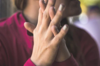 A close-up of hands shaking, symbolizing trust and commitment to people over politics.