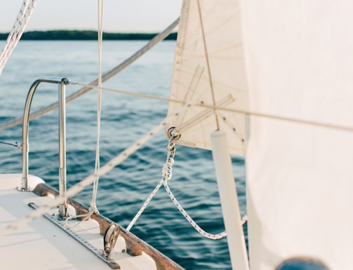 white and gray boat on body of water