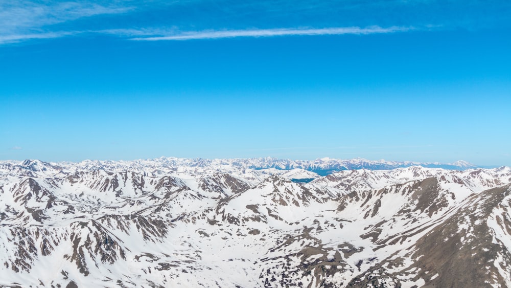 aerial photography of snow capped mountain range during daytime