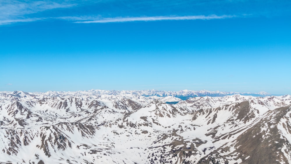 Series of snow-capped mountain ridges stretching to the horizon
