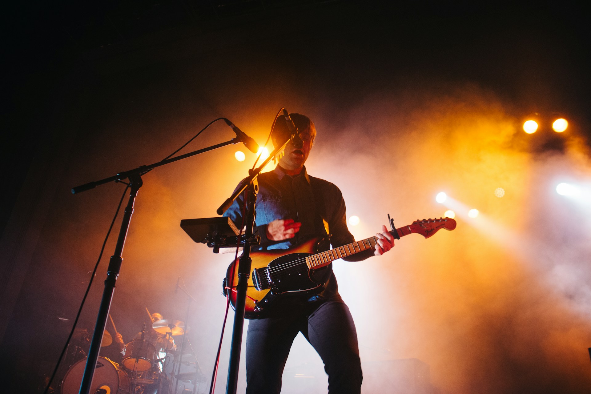 man playing electric guitar
