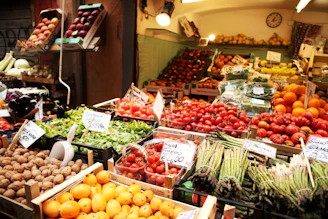 A vibrant farmer's market stand filled with fresh local produce under natural light.