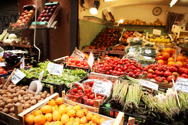 Close-up of a vibrant farmer’s market stall displaying fresh, colorful produce in natural light.