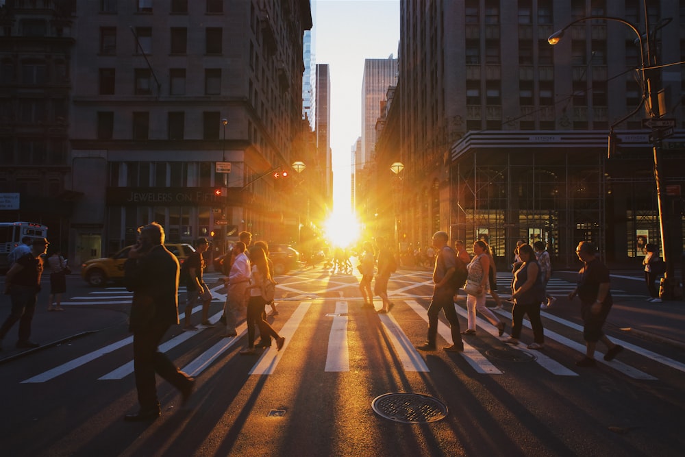 group of people walking on pedestrian lane