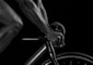 grayscale photography of man riding bicycle