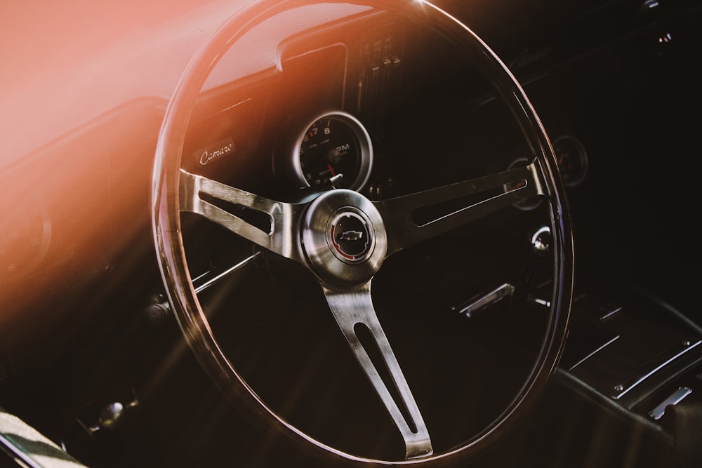 A steering wheel in a classic car.