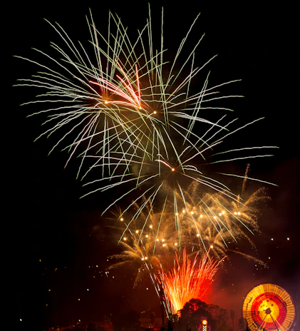 A festive scene showing free spins bonus round with animated fireworks on screen.