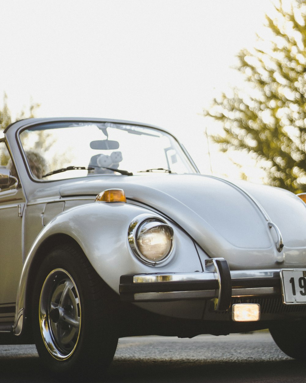 white Volkswagen Beetle convertible