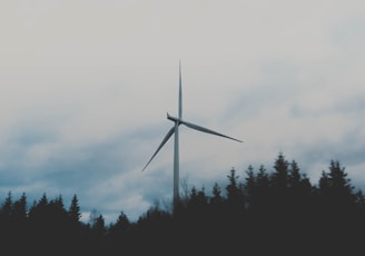 white windmill during cloudy sky