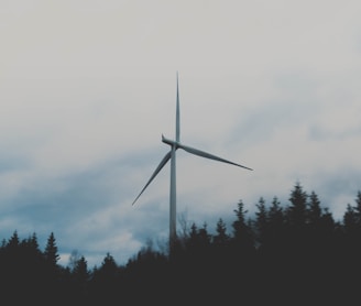 white windmill during cloudy sky