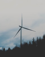 white windmill during cloudy sky