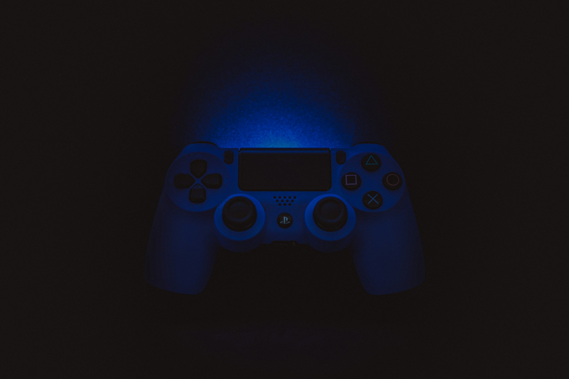 silhouette photography of Sony DualShock 4