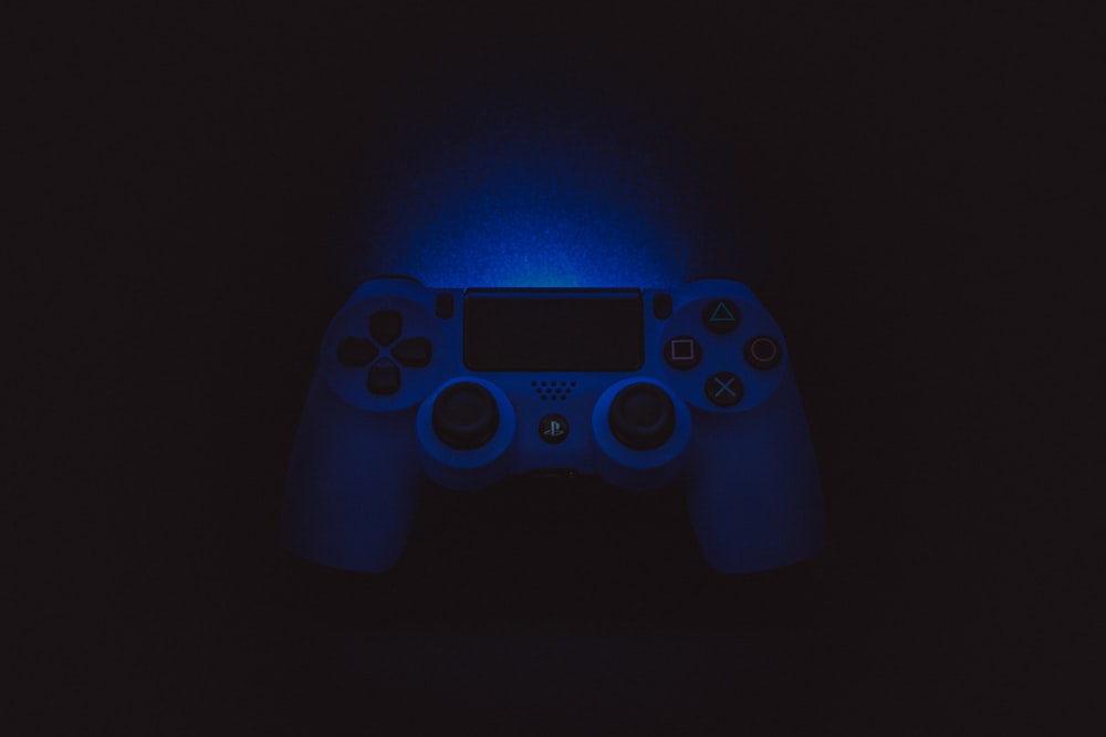 silhouette photography of Sony DualShock 4