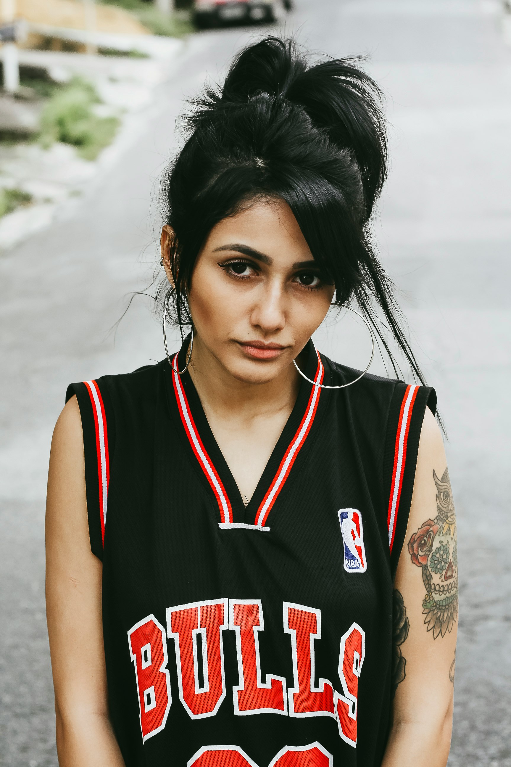 woman in black Bulls jersey top