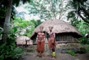two men standing near house