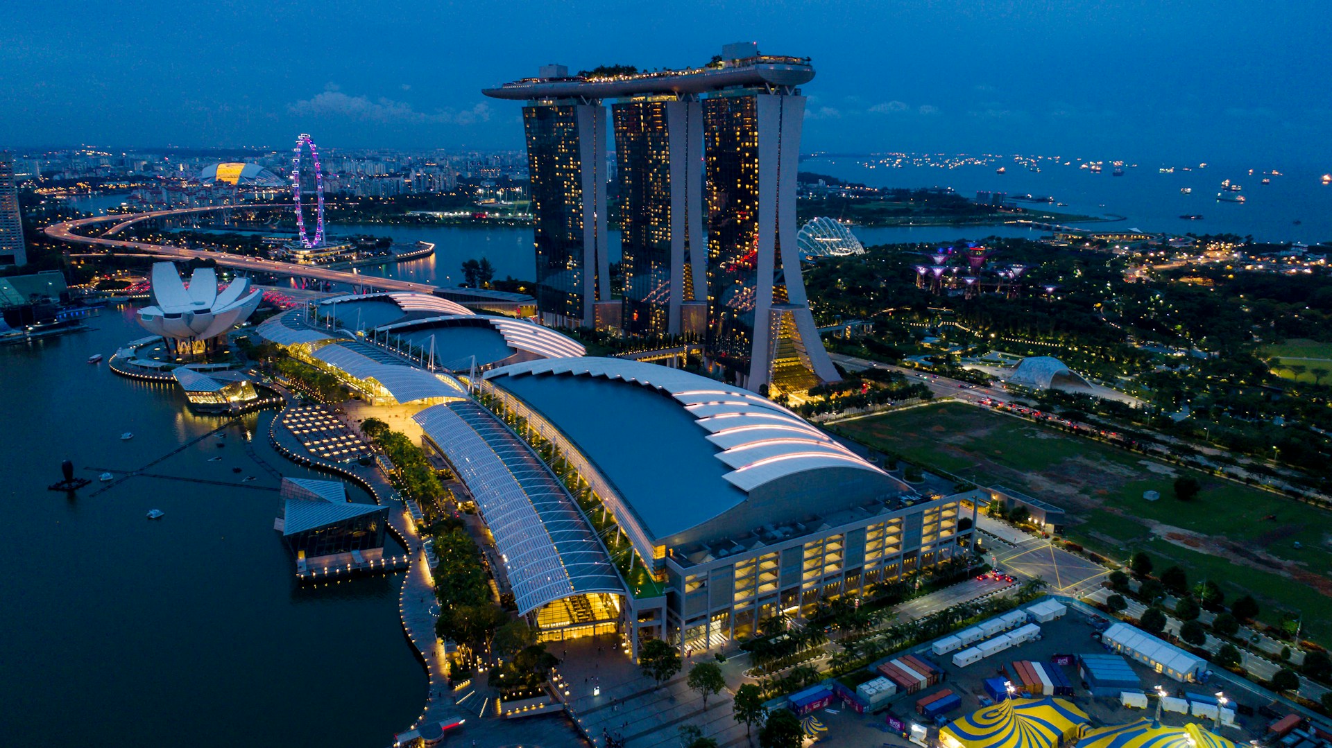 woman wearing yellow long-sleeved dress under white clouds and blue sky during daytime