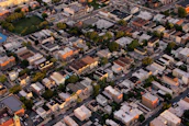 Aerial shot of a bustling Guntur neighborhood with various properties.